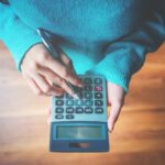 Woman using a calculator